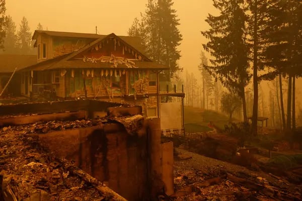 Property and homes razed by a wildfire in Celista, British Columbia, Canada, on Saturday, Aug. 19, 2023. Record-breaking wildfires in Canada, which have already scorched an area larger than Greece, are heading toward key population centers, forcing tens of thousands to evacuate. Photographer: Bloomberg/Bloomberg