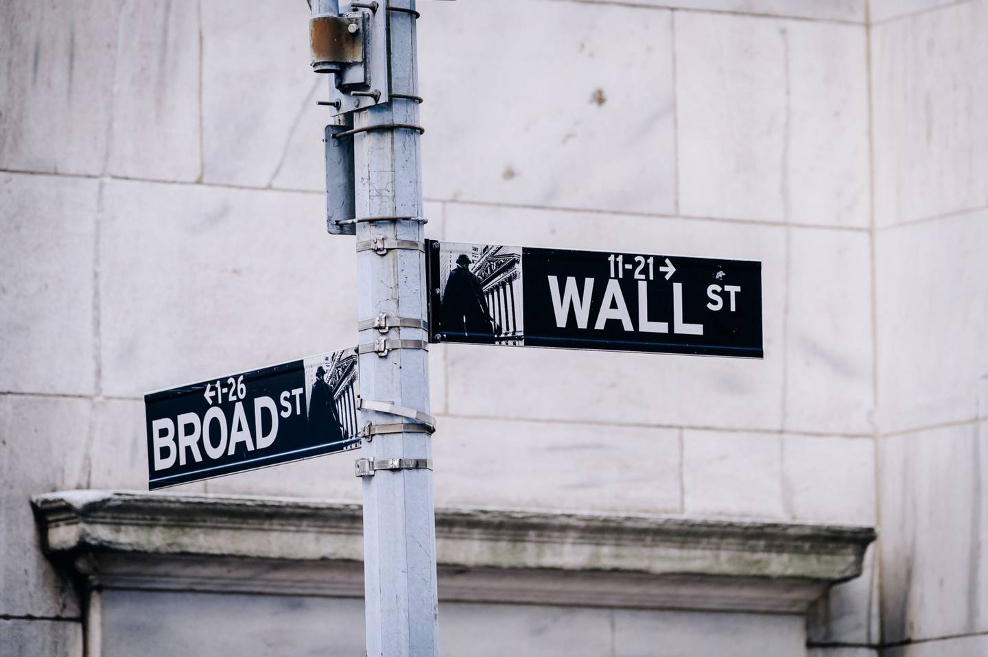 Signage for Wall Street and Broad Street in New York City. Photographer: Nina Westervelt/Bloomberg