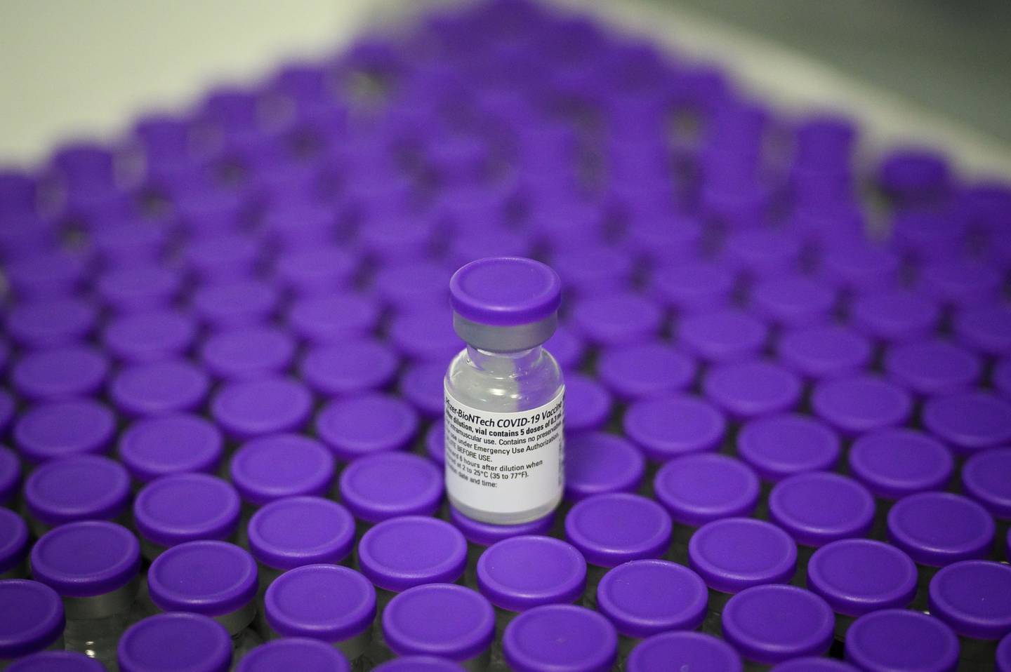 STRATFORD, ENGLAND - DECEMBER 15: Vials of the Pfizer/BioNTech Covid-19 vaccine are seen during a vaccination clinic at the Sir Ludwig Guttmann Health and Wellbeing Centre on December 15, 2020 in Stratford, England.