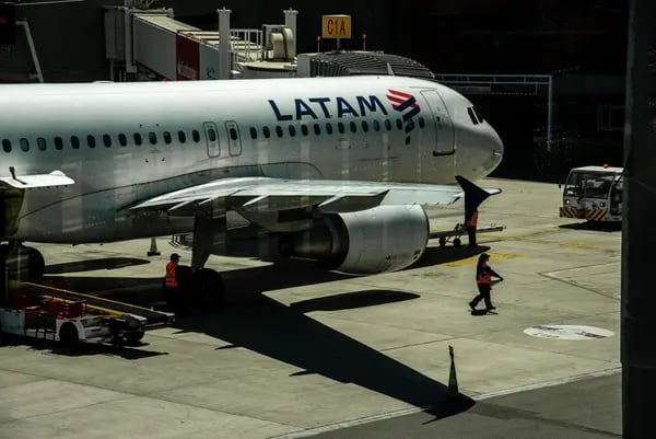 A Latam Airlines aircraft on the tarmac of Arturo Merino Benitez International Airport (SCL) in Santiago.