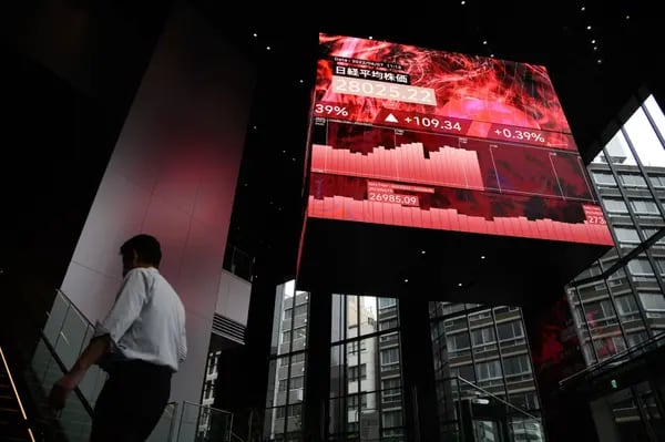 The Nikkei 225 Stock Average displayed on a rotating-cube screen in an atrium of the Kabuto One building, next the Tokyo Stock Exchange, in Tokyo.