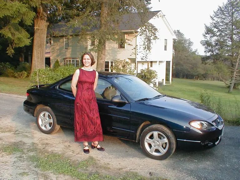 With her first car: a Ford ZX2, in Maryland. Photo: Laura Klauserdfd