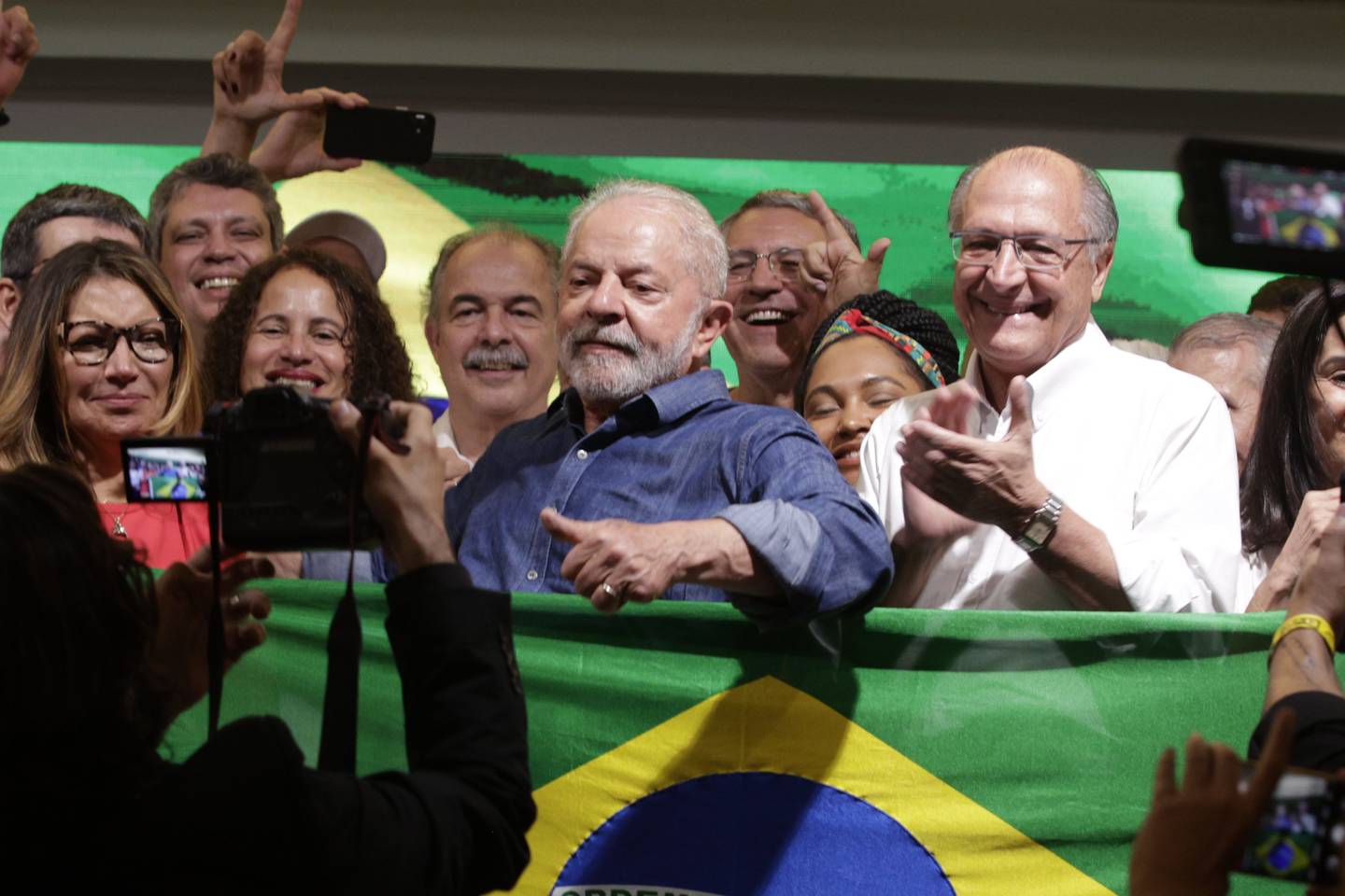 Luiz Inacio Lula da Silva, Brazil's president-elect, center, poses for a photograph after winning the runoff presidential election in Sao Paulo.
