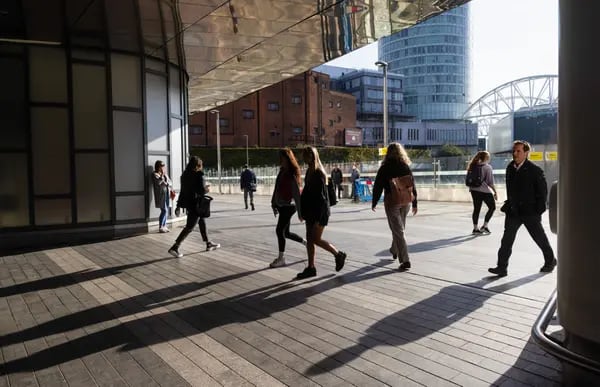 Commuters enter Birmingham New Street railway station in Birmingham, U.K., on Friday, May 6, 2022. Two years of economic stagnation and almost 600,000 job losses are the price of taming U.K. inflation, estimates from the Bank of England indicate.