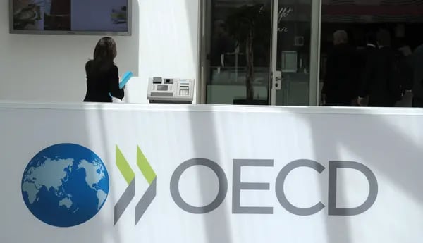 A participant stands at the OECD headquarters in Paris.