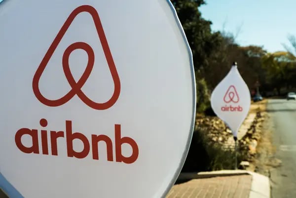 The logos of Airbnb Inc. sit on banners displayed outside a media event in Johannesburg, South Africa, on Monday, July 27, 2015. Airbnb is hoping to spread its unique brand of hospitality throughout Africa. Photographer: Waldo Swiegers/Bloomberg