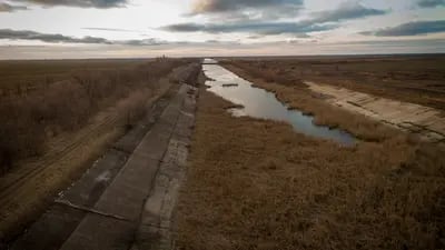 A section of the Northern Crimean Canal where it becomes dry, below a makeshift dam in the Kalanchatski region of Kherson Oblast, Ukraine. The dam has blocked water from reaching Crimea, approximately 25 kilometers south, since 2014. 