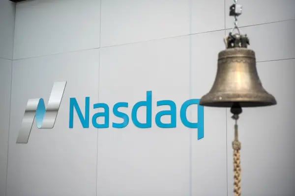 A trading bell hangs in front of Nasdaq signage inside the Nasdaq Swedish Stock Exchange in Stockholm, Sweden, on Thursday, Jan. 31, 2019.