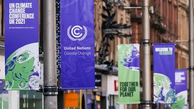 Banners advertising the upcoming COP26 climate talks in Glasgow, U.K., on Wednesday, Oct. 20, 2021. Glasgow will welcome world leaders and thousands of attendees for the crucial United Nations summit on climate change in November.