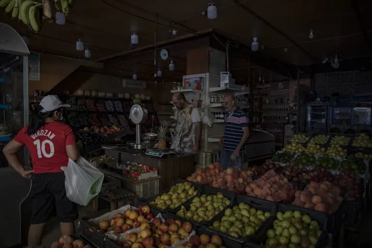 A customer buys food during a power outage in Beirut, Lebanon, on September 7, 2021. Photographer: Francesca Volpi/Bloombergdfd
