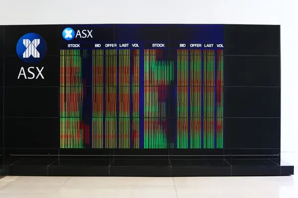 An electronic board displays stock information at the Australian Securities Exchange, operated by ASX Ltd., in Sydney, Australia, on Tuesday, Feb. 6, 2018. Global equity markets are in retreat after Wall Street losses that began in the final session of last week worsened on Monday, with the Dow Jones Industrial Average posting its biggest intraday point drop in history. Photgrapher: Brendon Thorne/Bloomberg