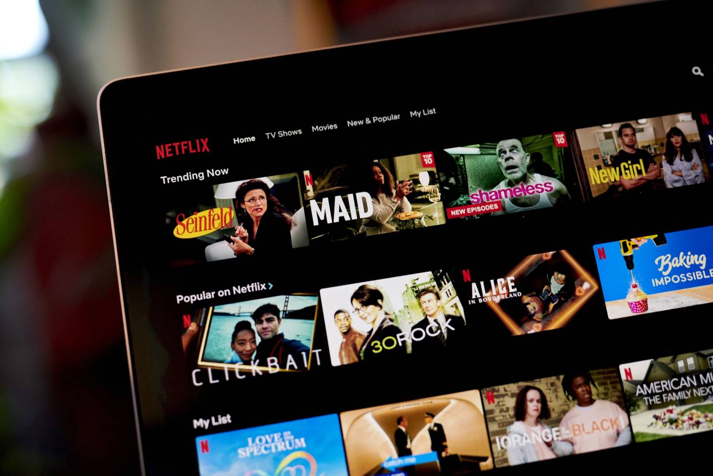 The Netflix Inc. website is displayed on a laptop computer in an arranged photograph taken in the Brooklyn Borough of New York.