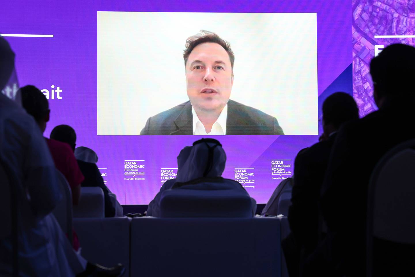 Elon Musk speaks via video link during the Qatar Economic Forum in Doha.