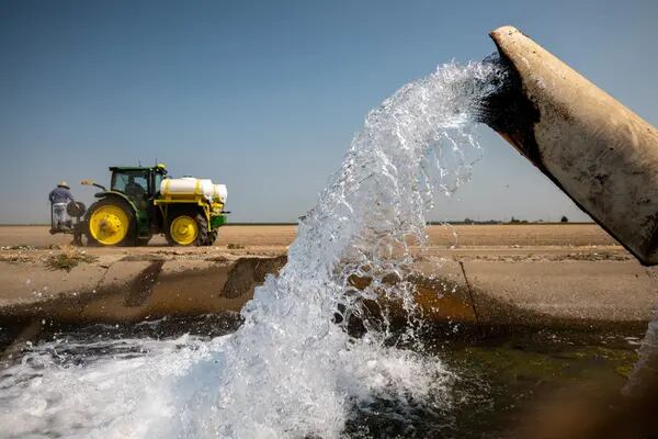 Water is pumped from a well into an irrigation canal on a farm in Yolo County, California, U.S., on Wednesday, Aug. 11, 2021. Photographer: David Paul Morris/Bloomberg