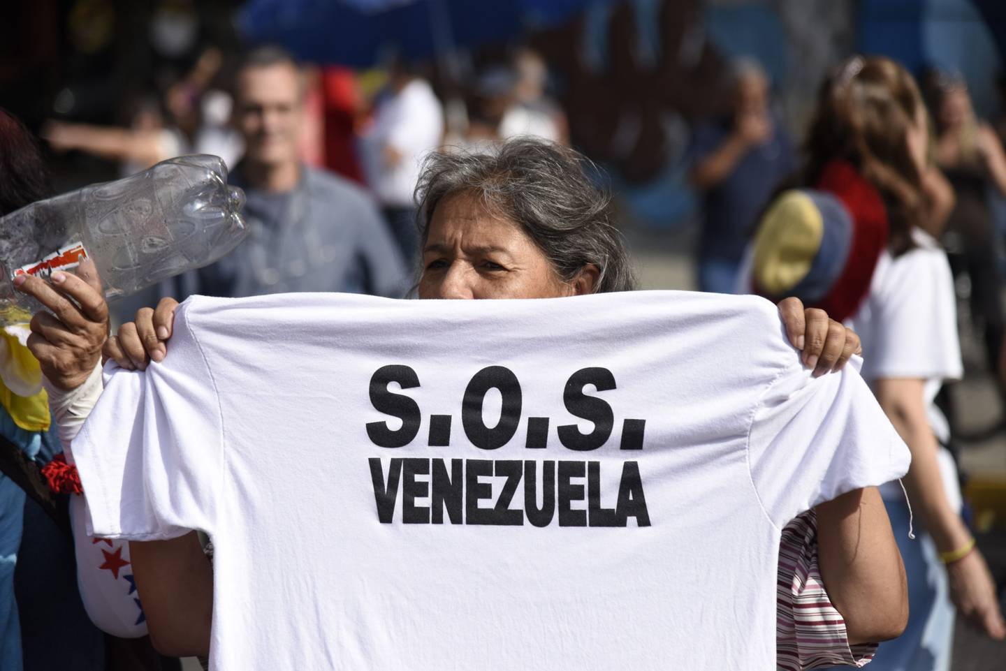 A participant holds a T-shirt during a protest against Venezuelan President Nicolas Maduro in Caracas, Venezuela, on Tuesday, March 12, 2019. Caracas began going dry Monday as the countrys power crisis put utilities out of commission, risking supplies for 5.5 million people. Photographer: Carlos Becerra/Bloomberg