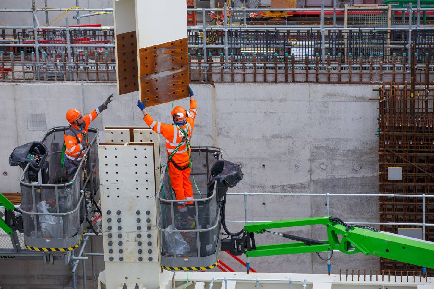 Contractors move a steel joist into position at Hinkley Point C nuclear power station construction site, near Bridgwater U.K., on Thursday, Sept. 23, 2021.