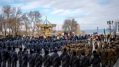Police officers and Ukrainian soldiers attend a rally in Odessa. The port city on the northwestern shore of the Black Sea has over 1 million people and is a short hop by sea from Crimea.