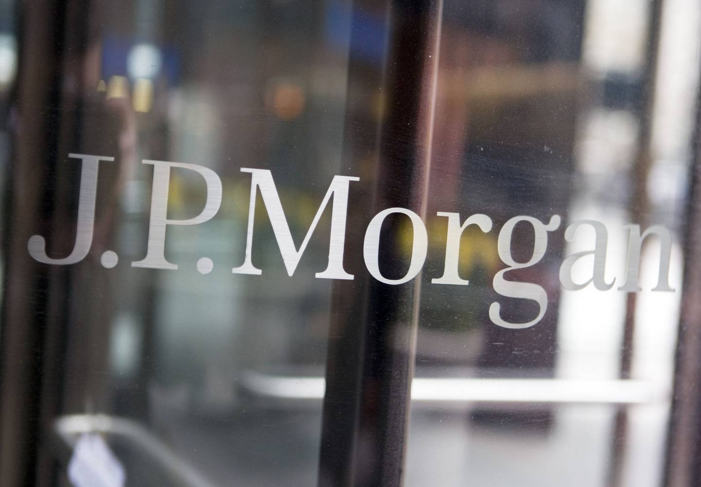 The JPMorgan Chase & Co. logo on a door. Photographer: ANDREW HARRERdfd