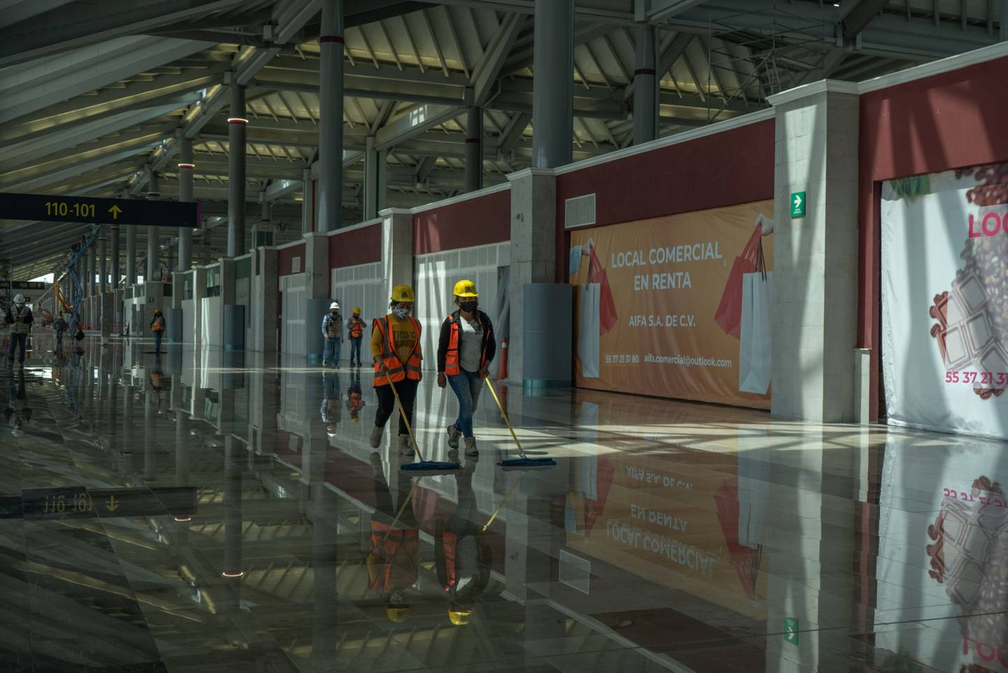 Contractors sweeps the floor of a terminal under construction at Felipe Angeles International Airport (AIFA) in Zumpango, Mexico, on Sunday, March 13, 2022.  Felipe Angeles International Airport is expected to open on March 21.dfd