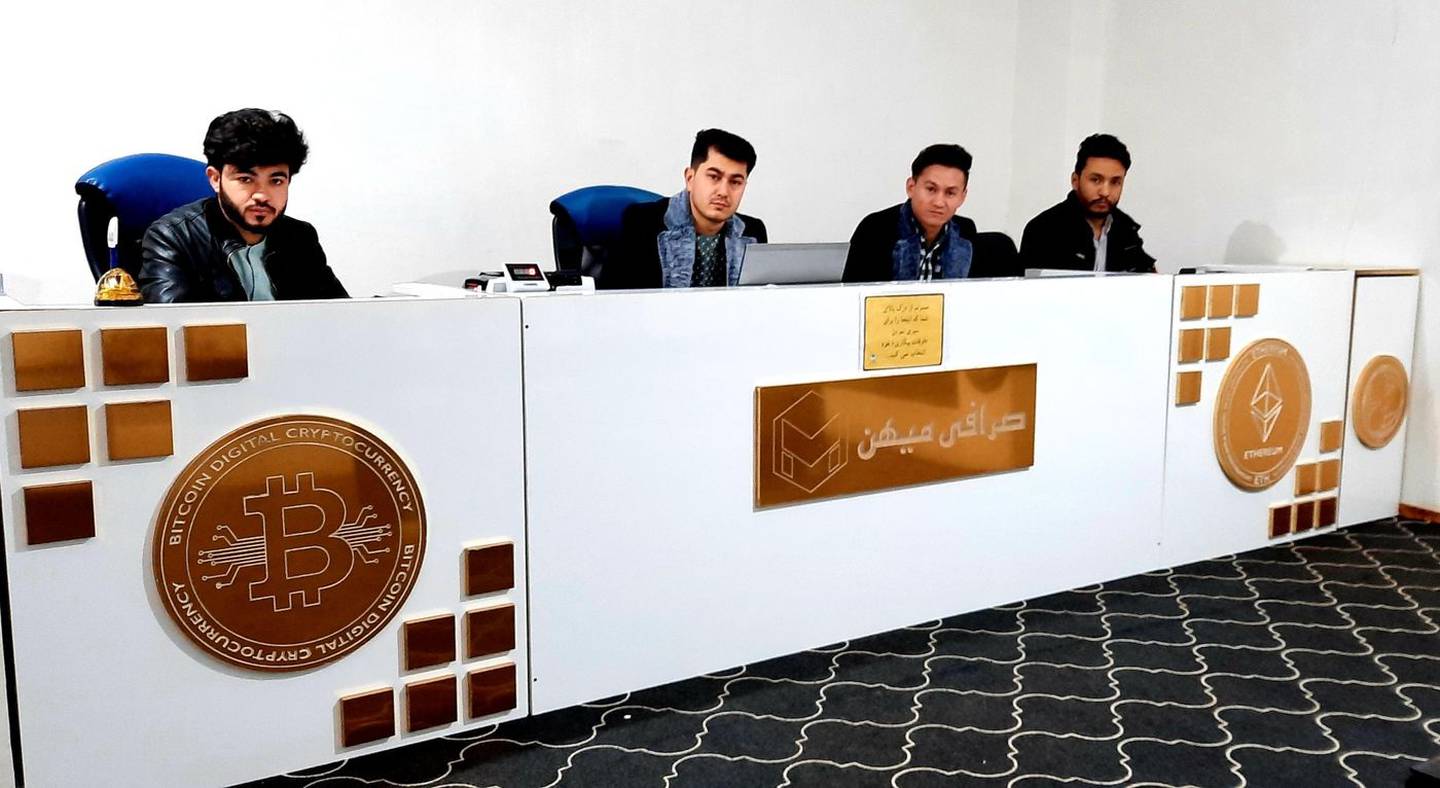 Timori, far right, and his staff at their office in Herat.