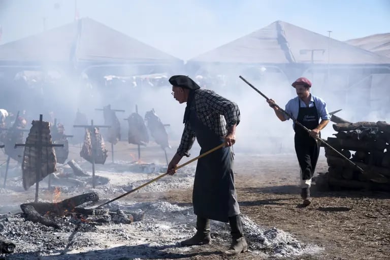 Workers prepare a traditional asado during the AgroActiva fair in Armstrong, Santa Fe, Argentina.dfd
