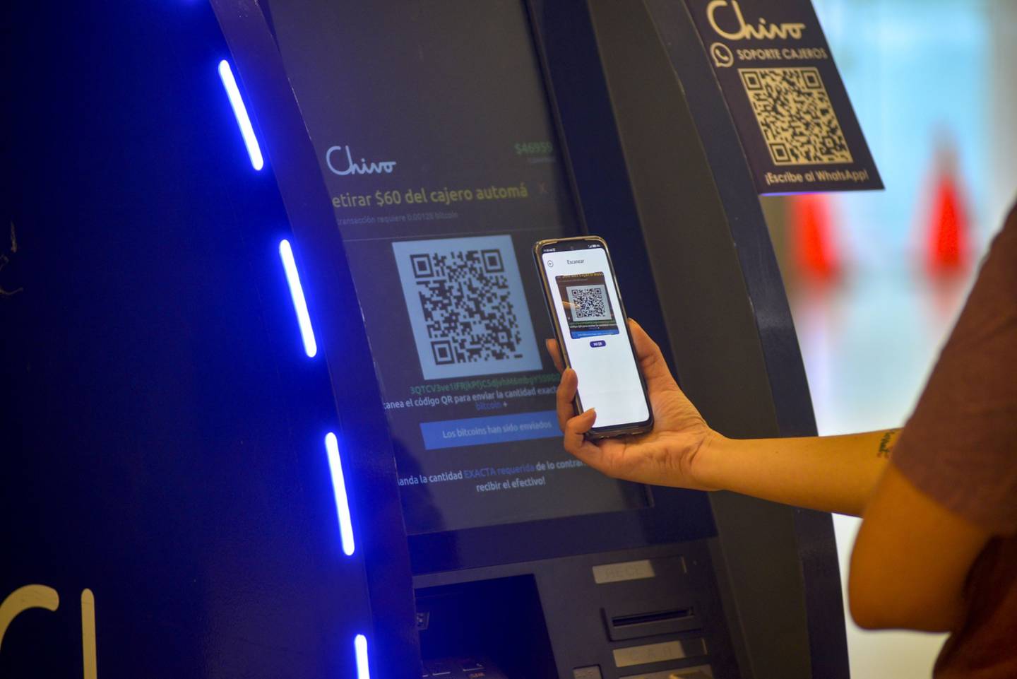 A customer uses a Chivo Bitcoin automated teller machine at the Cascadas shopping mall in San Salvador. Photographer: Camilo Freedman/Bloombergdfd