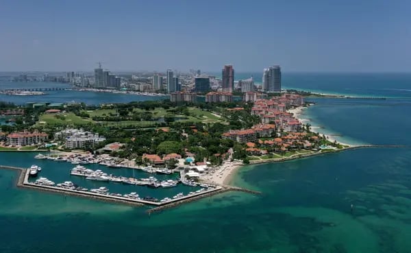 An aerial view of Fisher Island (foreground). Photographer: Joe Raedle/Getty Images