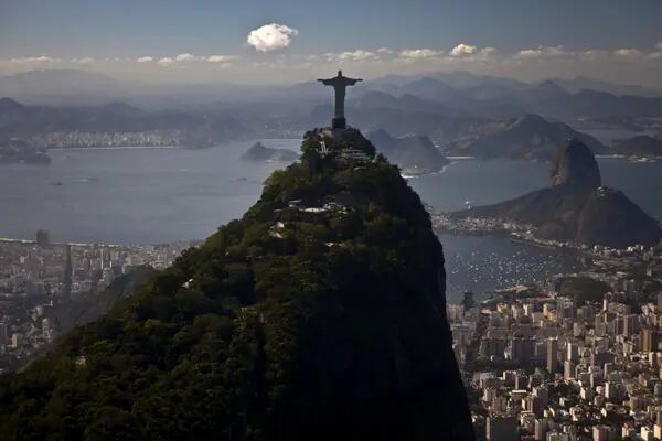 The Christ the Redeemer statue stands on top of Corcovado Mountain in this aerial photograph of Rio de Janeiro.