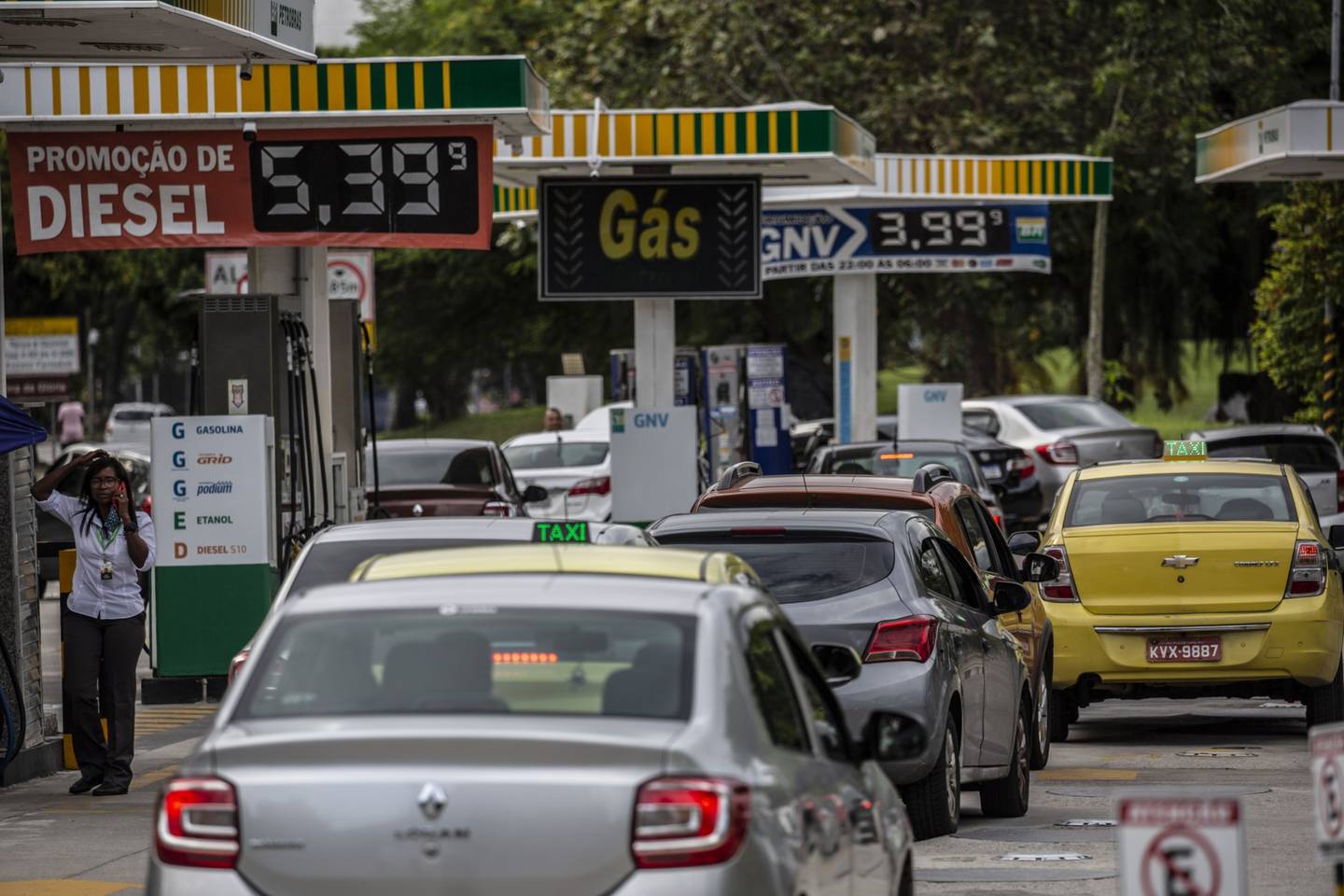 Vehicles wait in line at a Petrobras gas station in Rio de Janeiro, Brazil, on Thursday, Oct. 21, 2021.