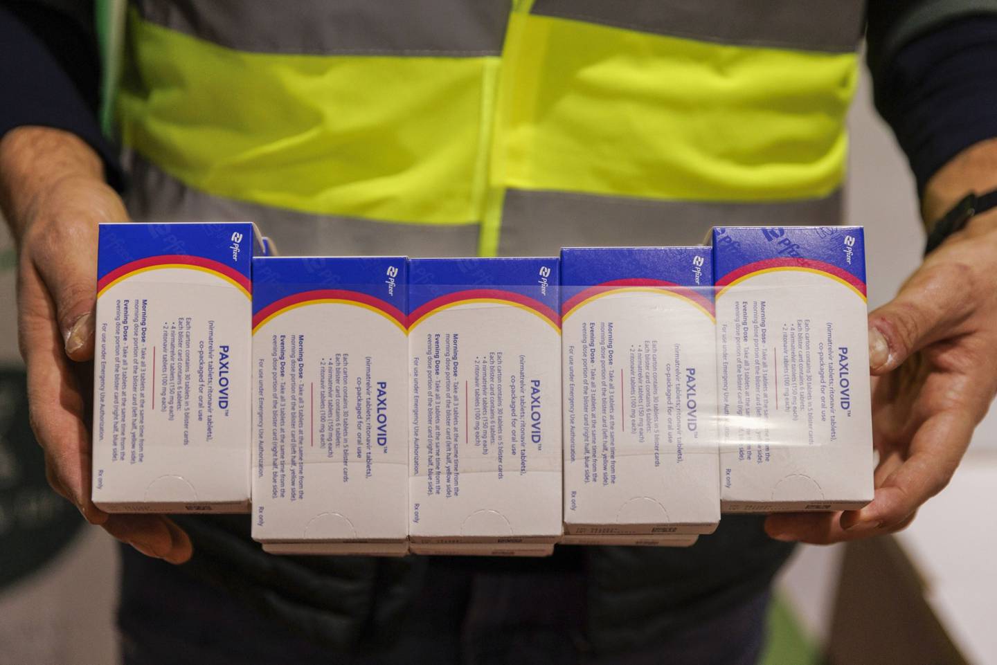 A worker unpacks boxes of Pfizer Inc.s Paxlovid antiviral medication in a warehouse in Shoham, Israel.