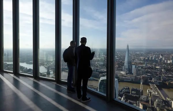 Visitors look out at the Shard skyscraper from the Horizon 22 public viewing gallery in the 22 Bishopsgate skyscraper in the City of London, UK, on Thursday, Sept. 14, 2023. The gallery, in the city's tallest skyscraper, will open to the public on Wednesday, Sept. 27. Photographer: Chris Ratcliffe/Bloomberg