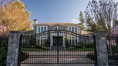 A home stands in Atherton, California, U.S., on Tuesday, Feb. 18, 2020. For the fourth straight year, Atherton topped Bloomberg's Richest Places annual index. With an average household income of more than $525,000, it became the first and so far only community to top the half-million dollar mark since Bloomberg started compiling the index in 2017. Photographer: David Paul Morris/Bloomberg