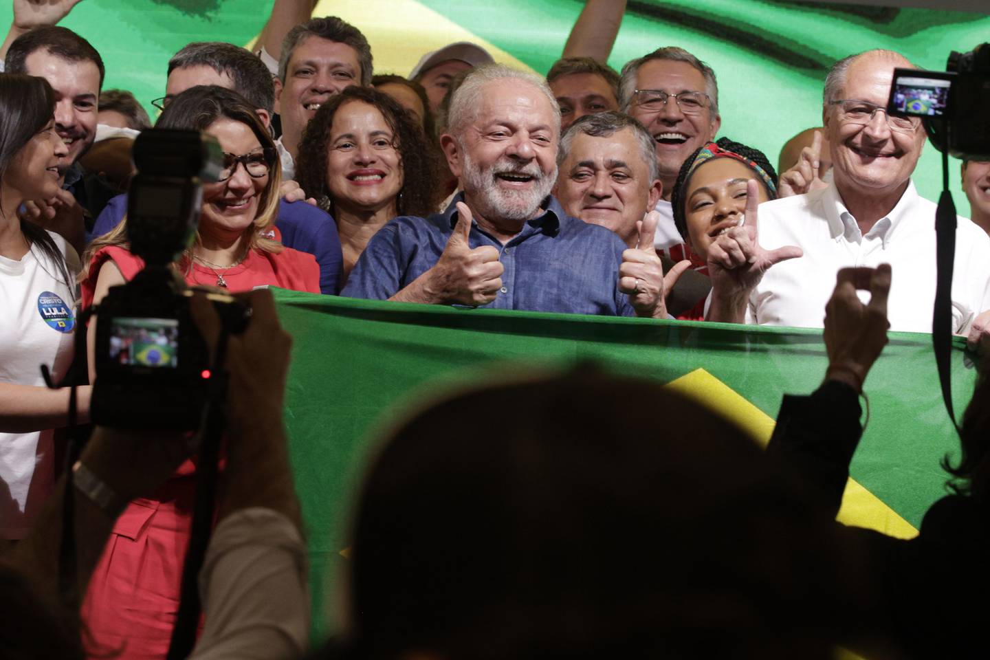 Luiz Inacio Lula da Silva, Brazil's president-elect, center, poses for a photograph after winning the runoff presidential election in Sao Paulo, Brazil, on Sunday, Oct. 30, 2022. Photographer: Tuane Fernandes/Bloomberg