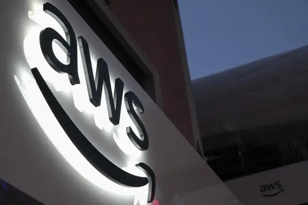 The logo of Amazon Web Services Inc (AWS) is displayed on a sign at a pop-up office ahead of the World Economic Forum (WEF) in Davos, Switzerland, on Monday, Jan. 21, 2019. World leaders, influential executives, bankers and policy makers attend the 49th annual meeting of the World Economic Forum in Davos from Jan. 22 - 25.