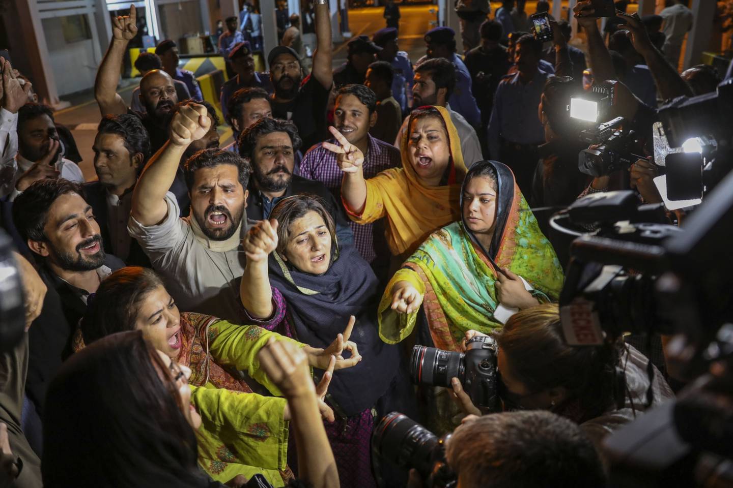 Lawmakers and supporters of Imran Khan, Pakistan's prime minister, chant slogans outside the National Assembly in Islamabad, Pakistan, on Sunday, April 10, 2022. Pakistan Prime Minister Imran Khan was ousted from office after losing a no-confidence vote following a week of dramatic political developments, becoming the first elected leader in the country's history to be removed by parliament.dfd