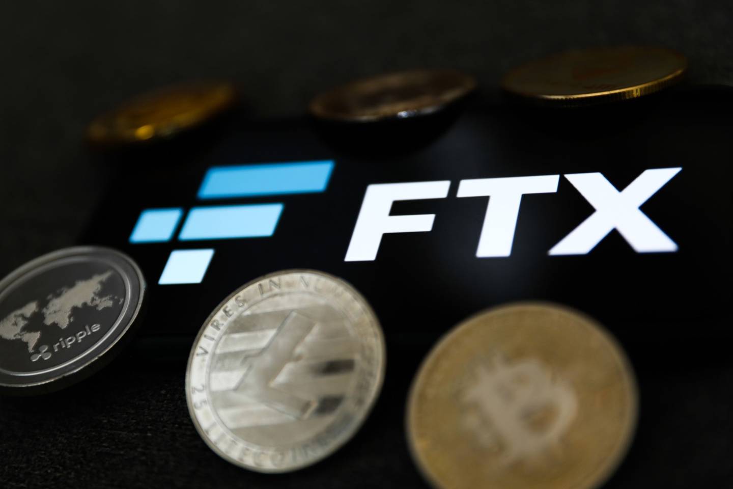 FTX logo displayed on a phone screen and representation of cryptocurrency are seen in this illustration photo taken in Krakow, Poland on February 16, 2022. Photographer: Jakub Porzycki/NurPhoto/Getty Images