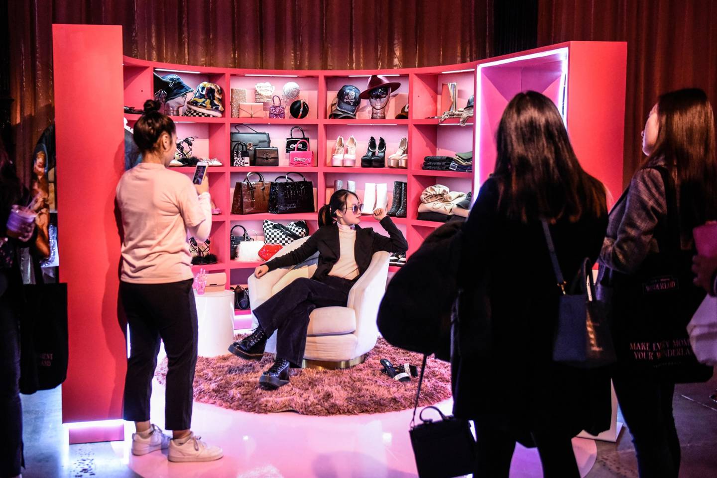 Shoppers take photos at the Shein pop-up store in New York.dfd