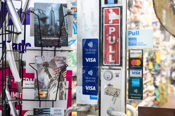 Credit Card Signage Ahead Of Earnings Figures