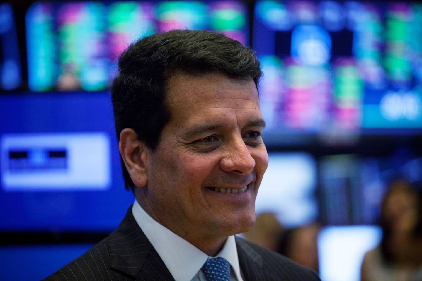 Felipe Bayon, chief executive officer of Ecopetrol SA, smiles on the floor of the New York Stock Exchange (NYSE) in New York, U.S., on Friday, Aug. 24, 2018. U.S. stocks rose, while the dollar deepened losses and Treasuries turned higher after the Federal Reserve chair signaled the central bank has no intention of accelerating the pace of rate hikes. Photographer: Michael Nagle/Bloomberg