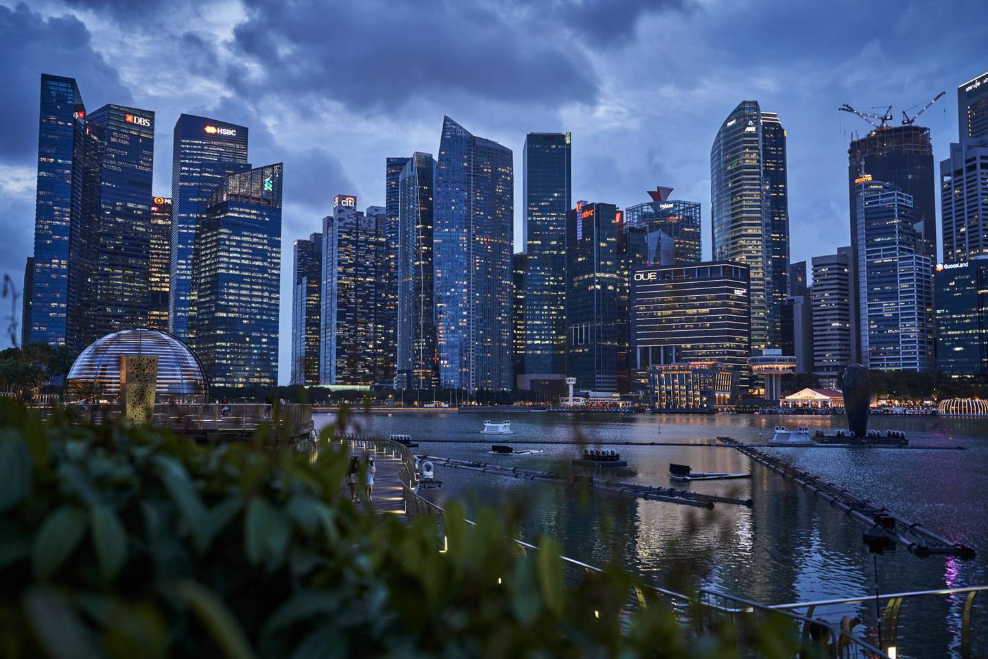 Buildings illuminated at dusk in the central business district (CBD) of Singapore, on Thursday, Jan. 28, 2021.