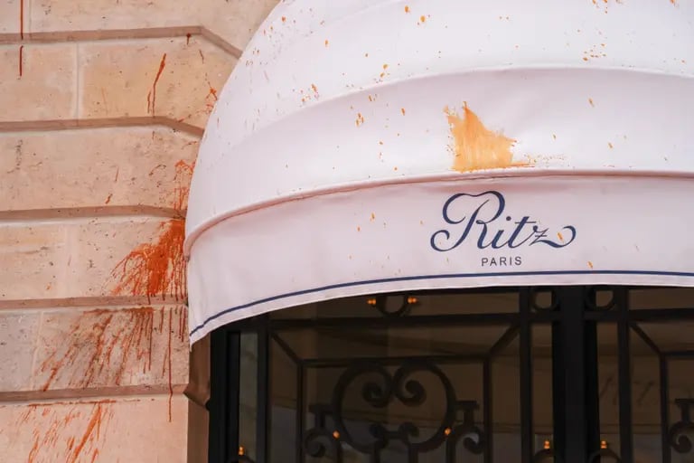Orange paint, thrown during a demonstration by climate activists, on the exterior of the Ritz Paris luxury hotel, on Place Vendome in Paris, France, on Monday, May 1, 2023. Photographer: Nathan Laine/Bloombergdfd