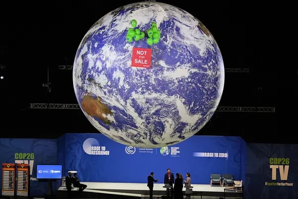 Greenpeace activists hold a protest in COP26.