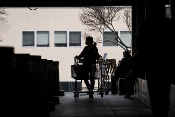 A customer wearing a protective mask exits a Costco store in San Francisco, California, U.S., on Wednesday, March 3, 2021. Costco Wholesale Corp. is schedule to release earnings figures on March 4.