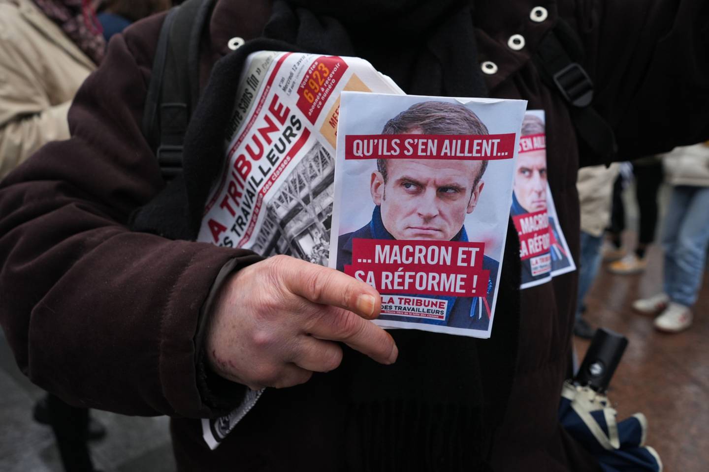 A protestor holds a poster during a demonstration in Paris on April 14.