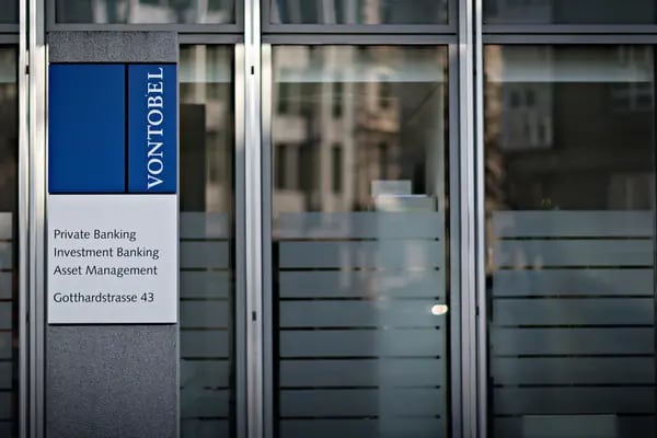 A logo sits on a sign outside the Vontobel Holding AG headquarters in Zurich, Switzerland, on Thursday, March 10, 2016. The Swiss economy returned to growth at the end of last year as it fought off the impact of a currency shock that had threatened to push the country into a recession. Photographer: Michele Limina/Bloomberg