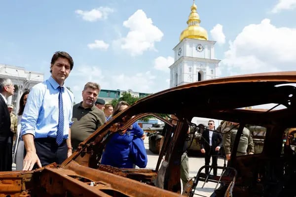 Canadian PM Justin Trudeau visits an exhibition of destroyed vehicles in Kyiv, June 10.