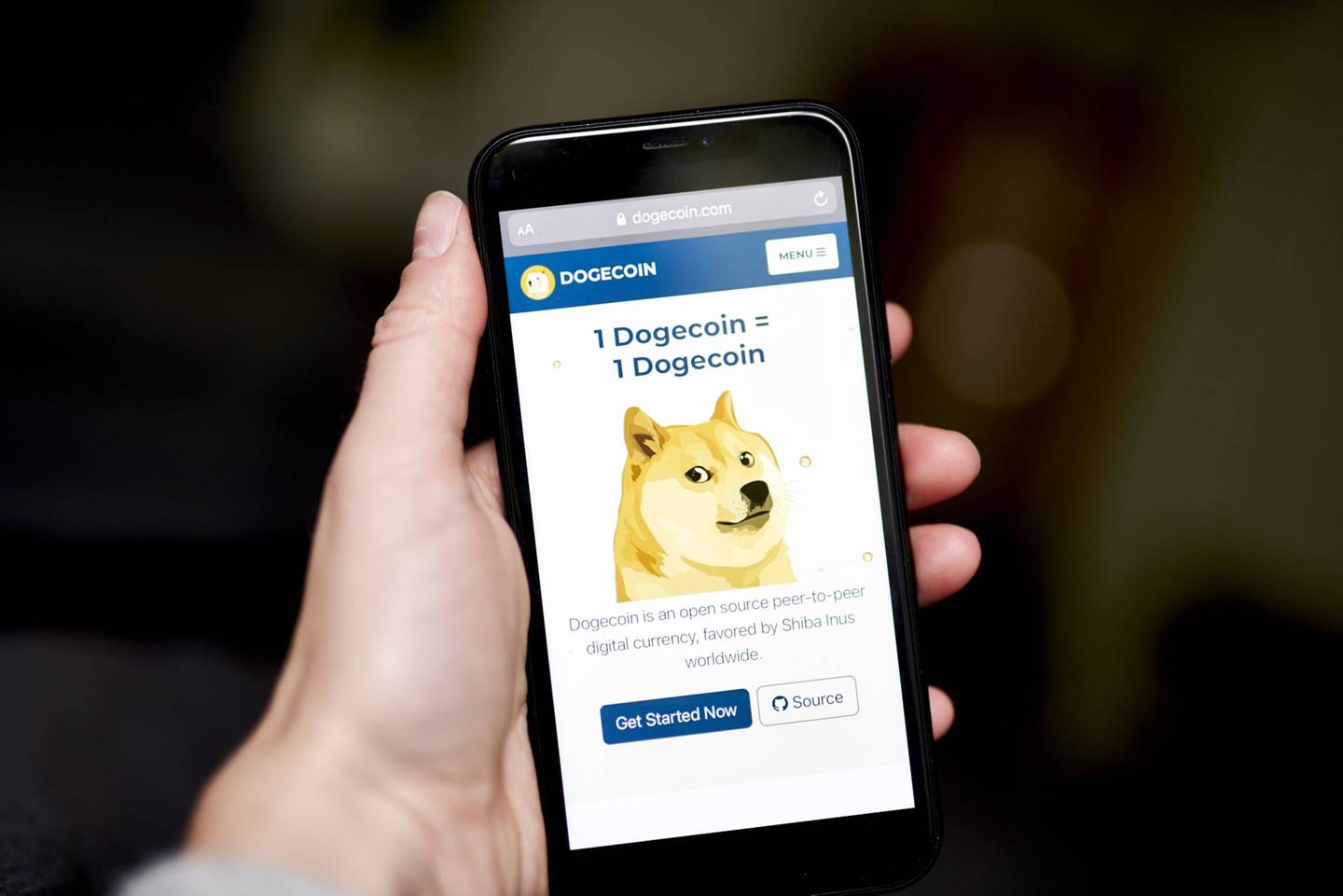 The Dogecoin website on a smartphone arranged in the Brooklyn borough of New York, U.S., on Friday, May 7, 2021.
