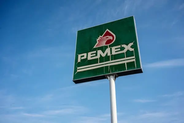 Signage is displayed outside a Petroleos Mexicanos (Pemex) gas station in Tepic, Nayarit state, Mexico, on Wednesday, April 22, 2020. Pemex has too much gasoline and nowhere to store it, potentially racking up significant ship fees as demand wanes because of the fast-spreading coronavirus. Photographer Cesar Rodriguez/Bloomberg