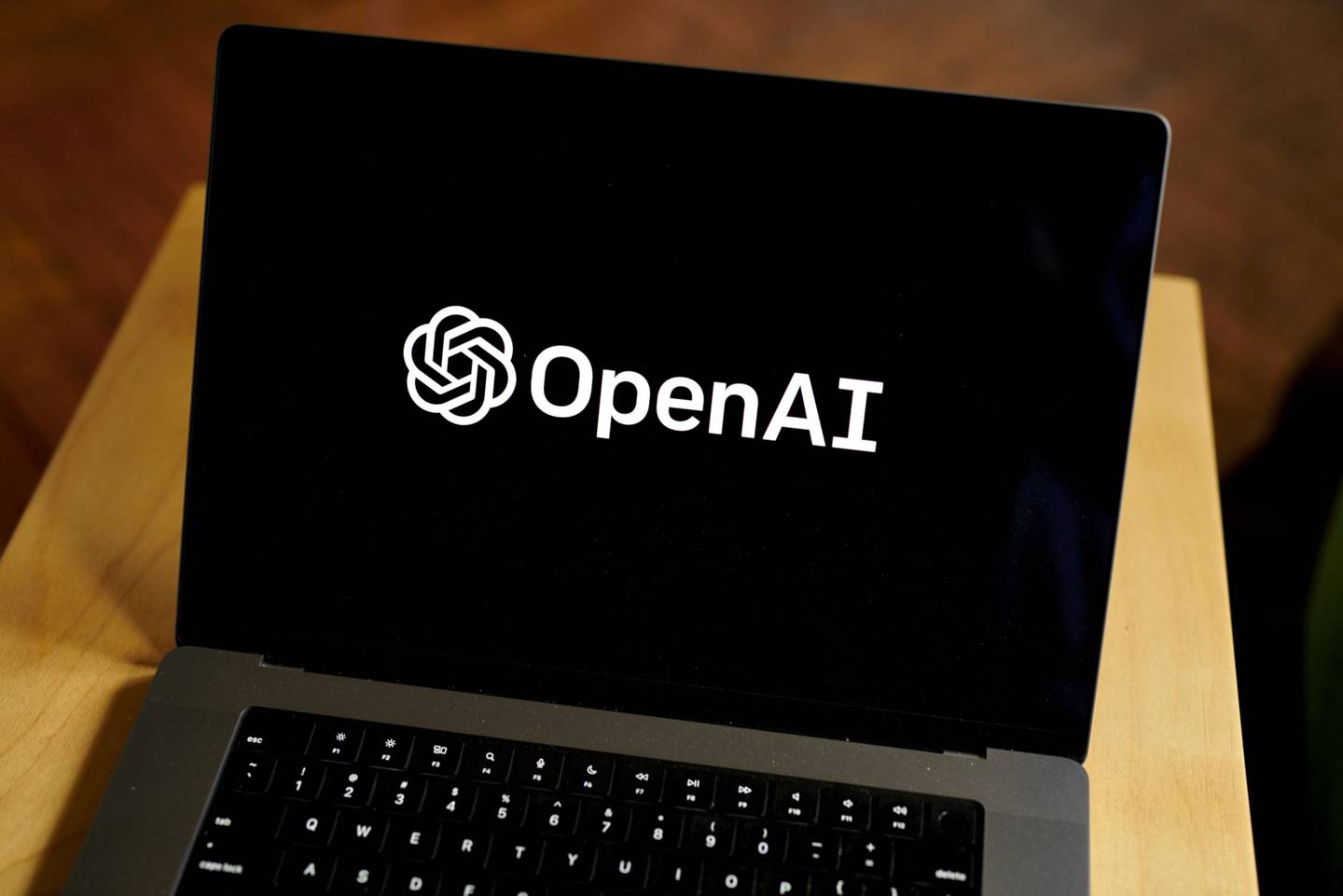 The OpenAI logo on a laptop computer arranged in the Brooklyn borough of New York, US, on Thursday, Jan. 12, 2023. Microsoft Corp. is in discussions to invest as much as $10 billion in OpenAI, the creator of viral artificial intelligence bot ChatGPT, according to people familiar with its plans. Gabby Jones/Bloombergdfd
