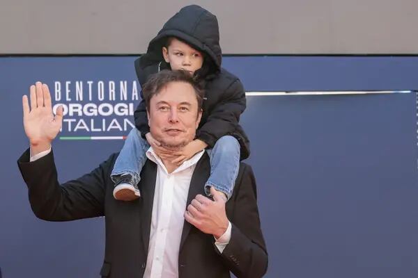 Elon Musk, chief executive officer of Tesla Inc., and his son arrive at the Atreju convention in Rome, Italy, on Saturday, Dec. 16, 2023. The annual event, organized by Giorgia Meloni’s Brothers of Italy party, began in 1998 as a convention for right-wing youths and has evolved into a political kermesse, including ministers and members of the opposition. Photographer: Alessia Pierdomenico/Bloomberg